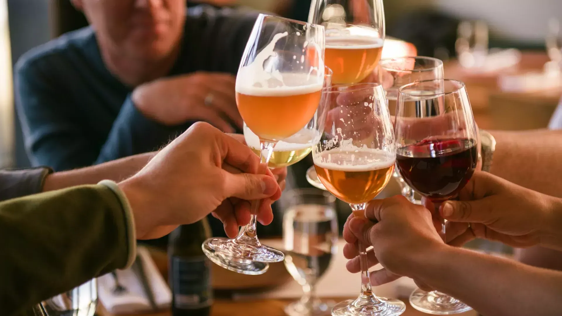 A group of travelers share a drink at a San Francisco bar.